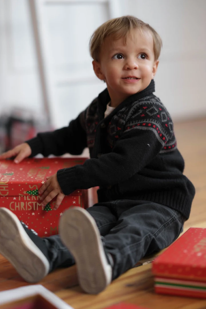 boy opening present - studio 342