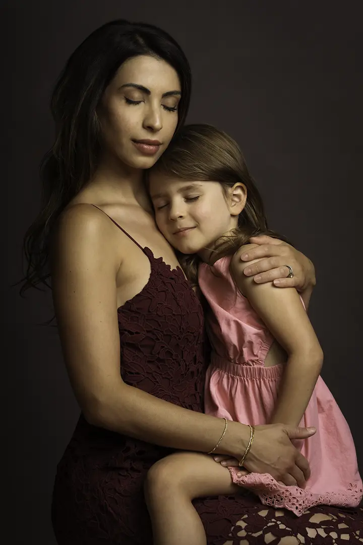 mom and daughter hugging for photo - studio 342 - Calgary lux portraiture