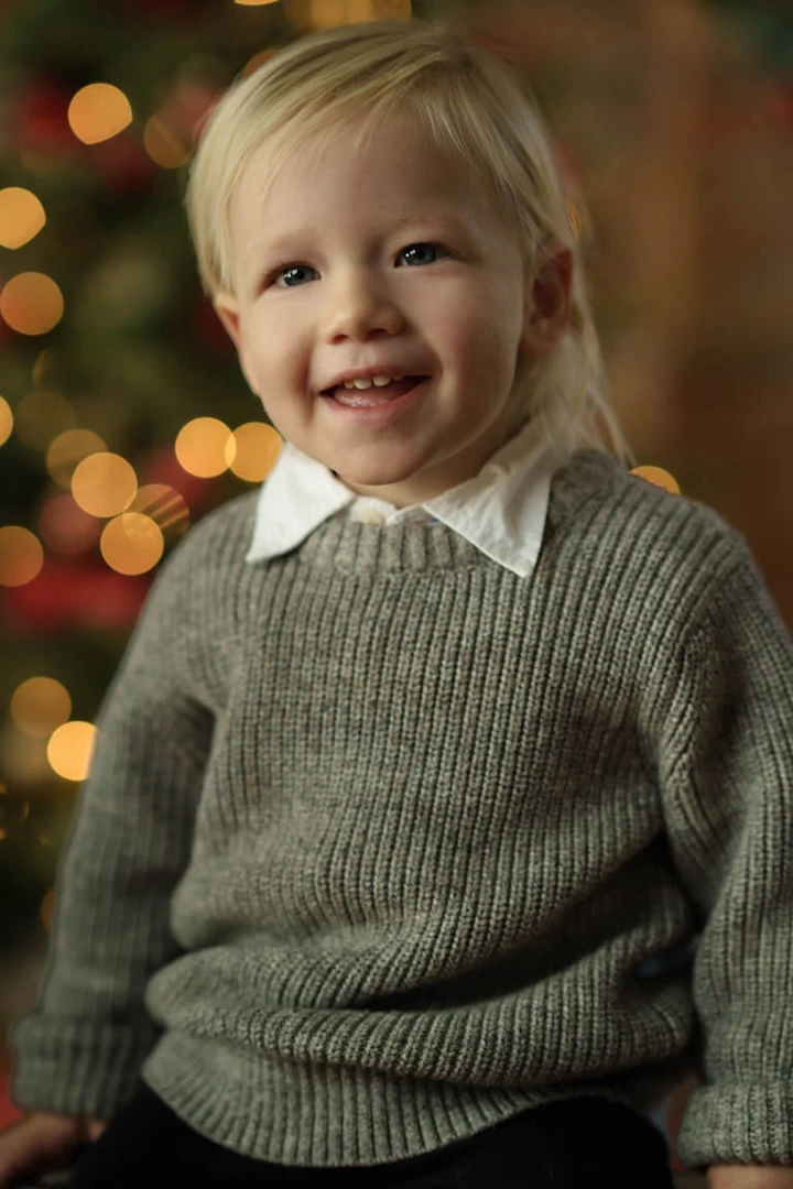 boy posing for xmas mini sessions - Calgary mini sessions