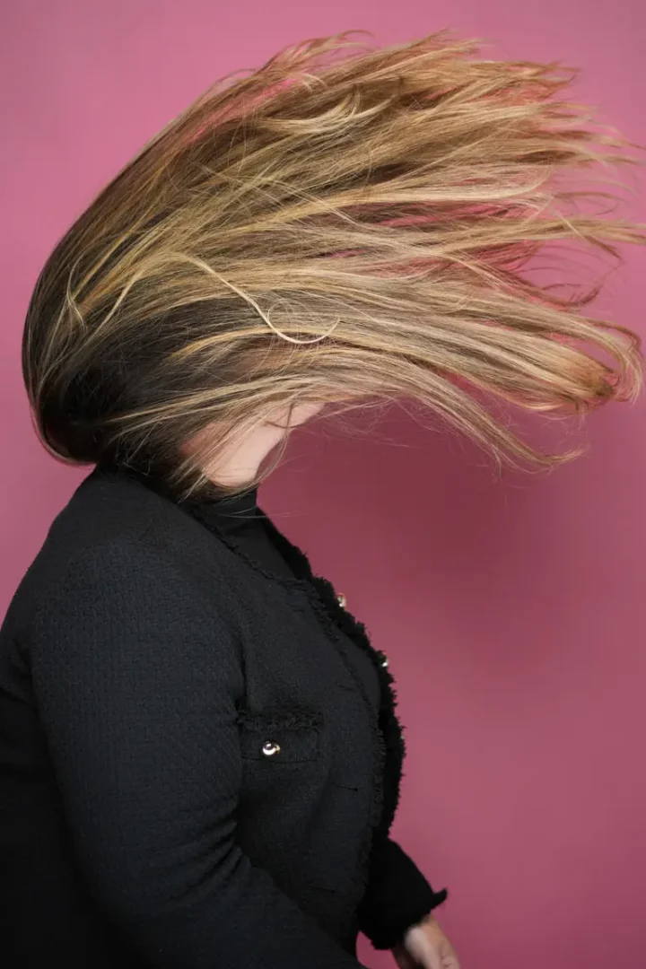 woman flipping hair during self portrait session - studio 342