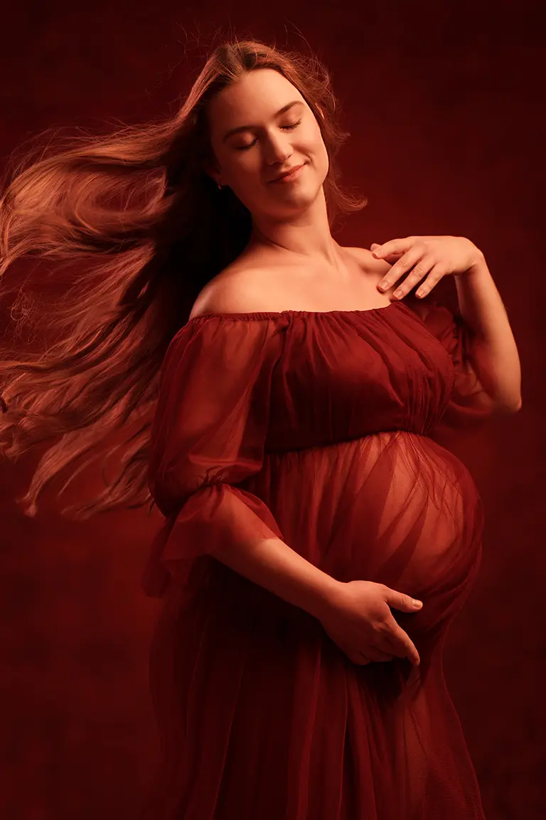 pregnant woman posing for maternity portrait at studio 342 - lux portraiture