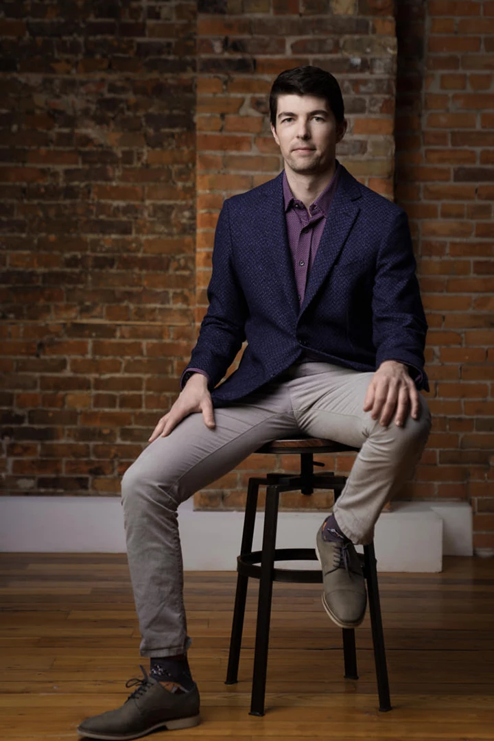man posing on stool - photography studio for rent