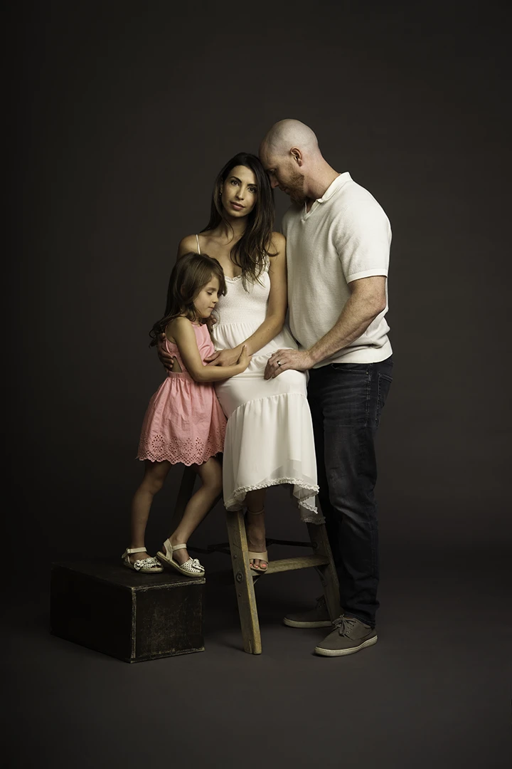 family posing on ladder and apple box - photo studio for rent