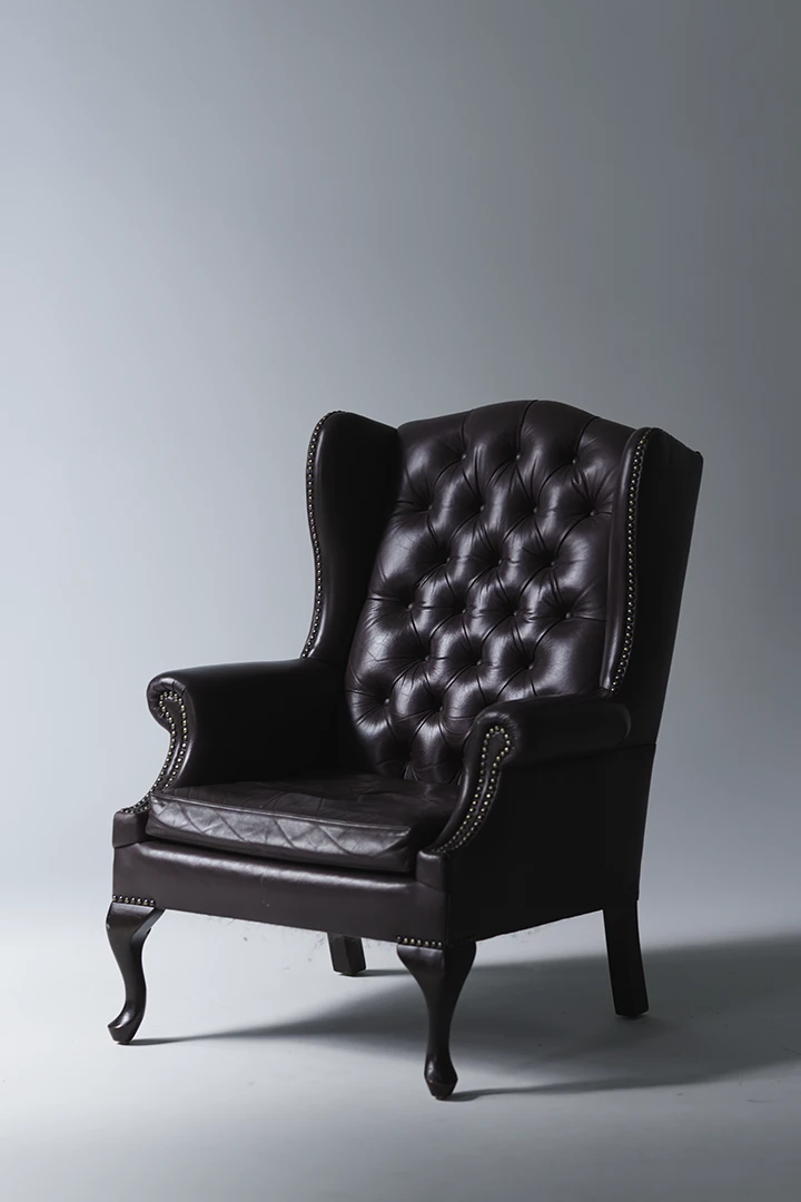 wingback chair on cyc wall - camera gear for rent