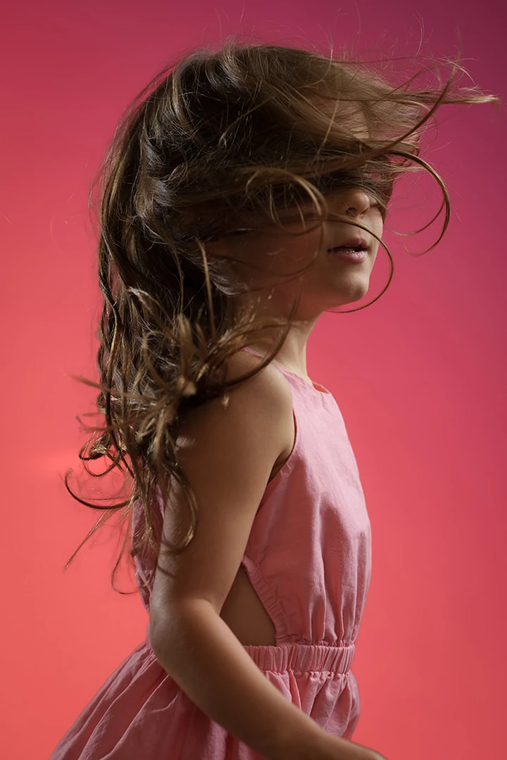 wind blowing over face - portrait of girl