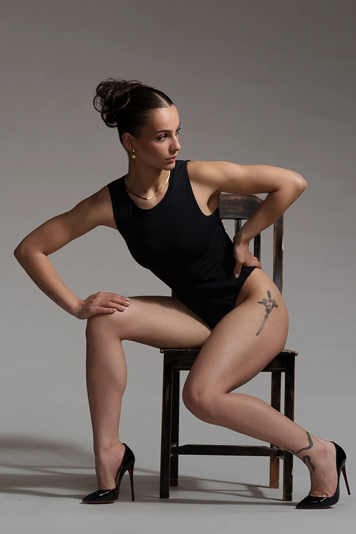 model posing on chair - equipment for rent at studio 342
