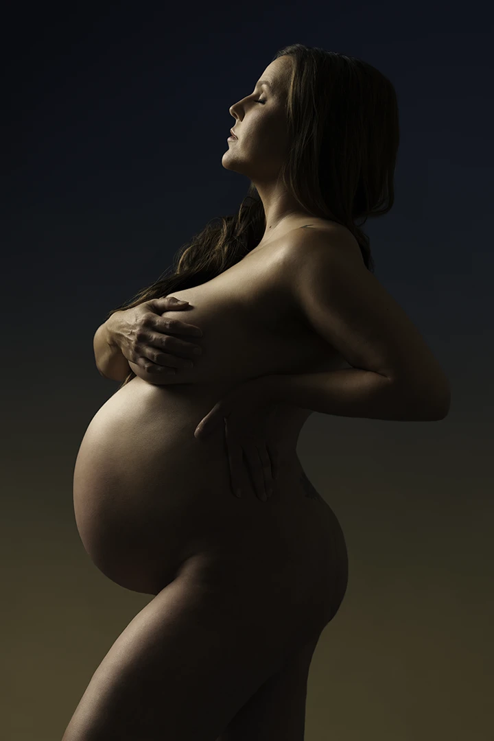 woman posing for maternity portrait - pregnancy photo studio