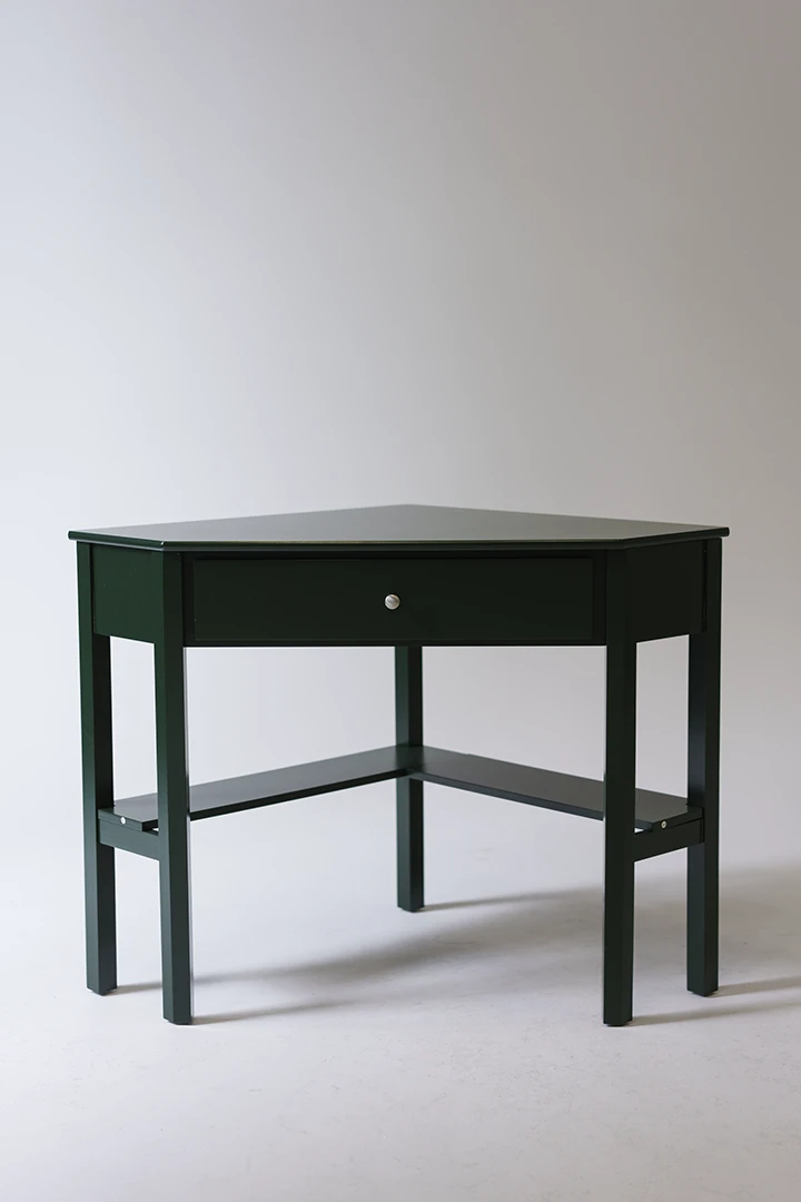 green corner desk photographed at cyc wall at studio 342