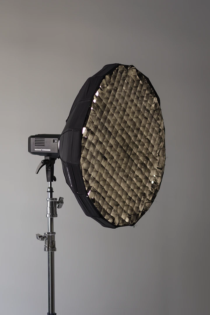 beauty dish modifier at photo studio with cyc wall in Calgary