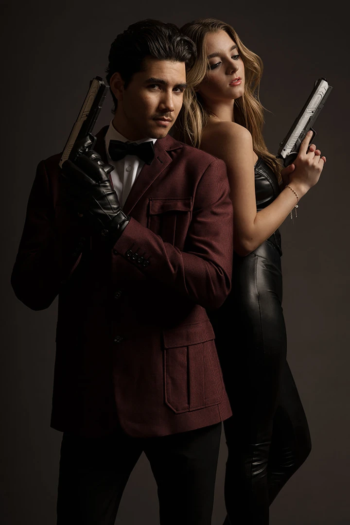 couple posing as james bond style pose at photo studio 342 Calgary