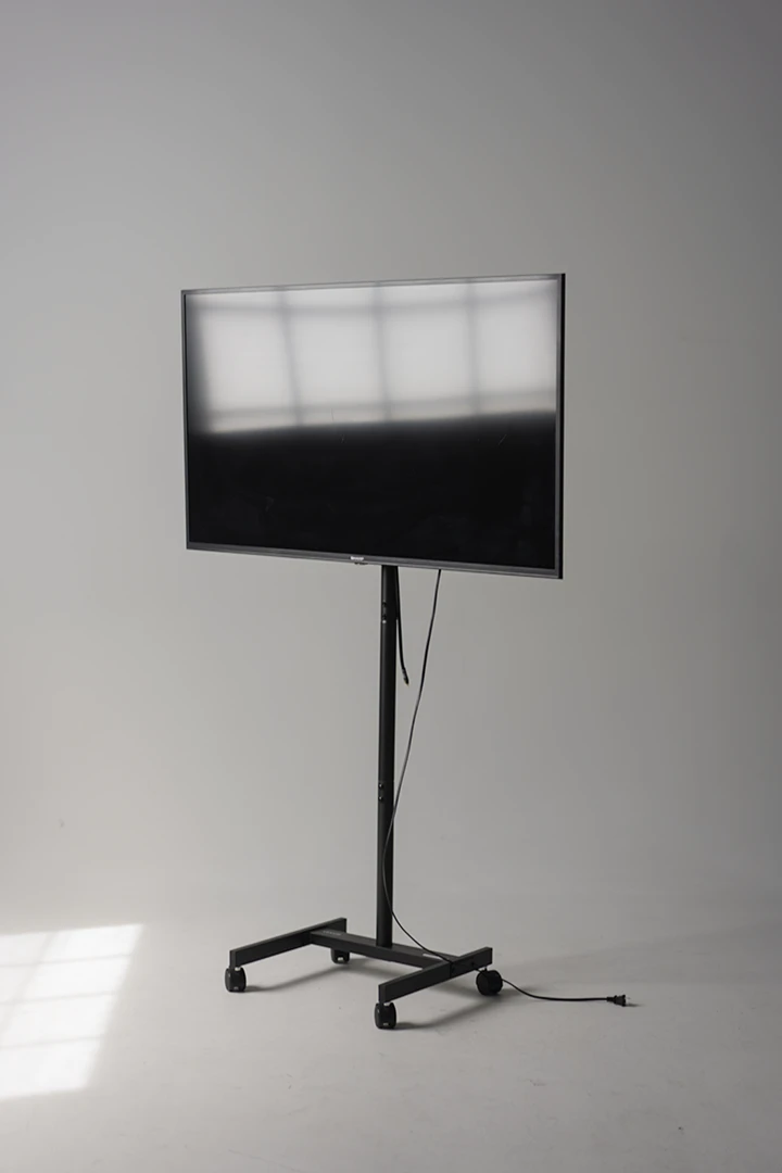 TV monitor on stand oriented in horizontal
