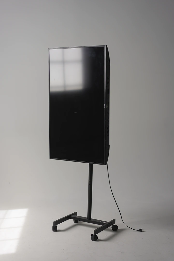 TV monitor on stand oriented in vertical